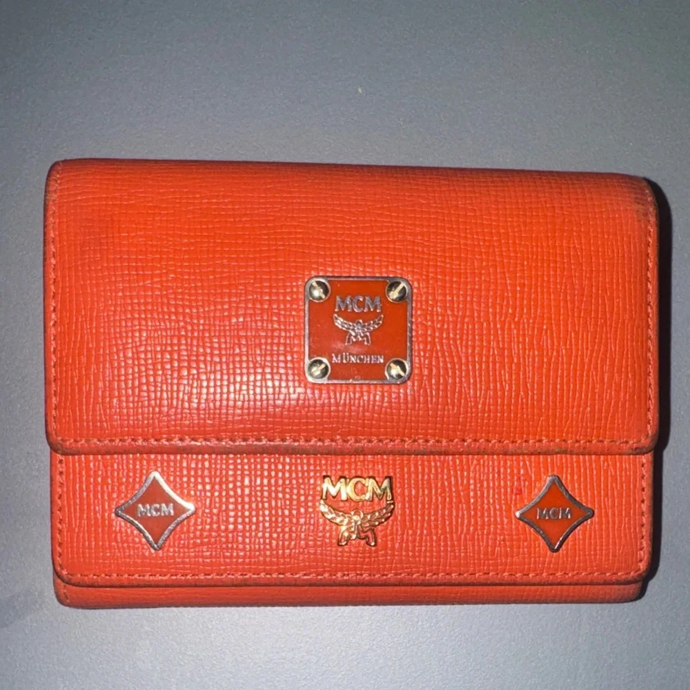 MCM Orange Leather Trifold Wallet with Gold Logo Accents